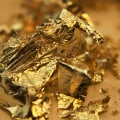 Which chemical is used to extract gold from its ore?