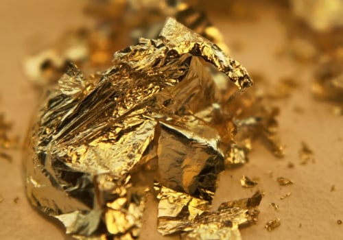 Which chemical is used to extract gold from its ore?